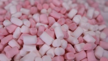 Marshmallow pembe ve beyaz şeker dönen arka plan