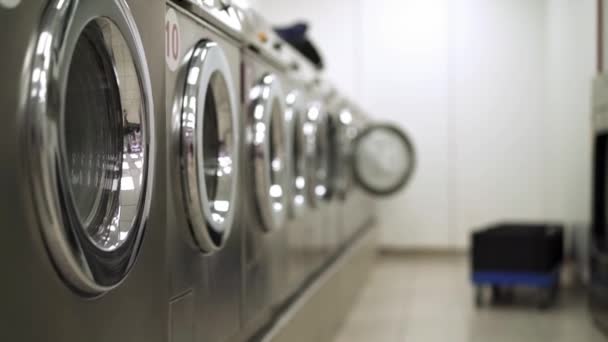 Row of not working washing machines in a Laundry — Stock Video