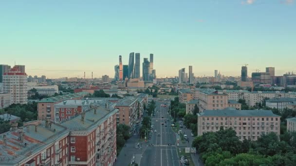 MOSCOW, RUSSIA - JUNE, 2019: Aerial drone shot of residential buildings and Moscow City on background — Stock Video