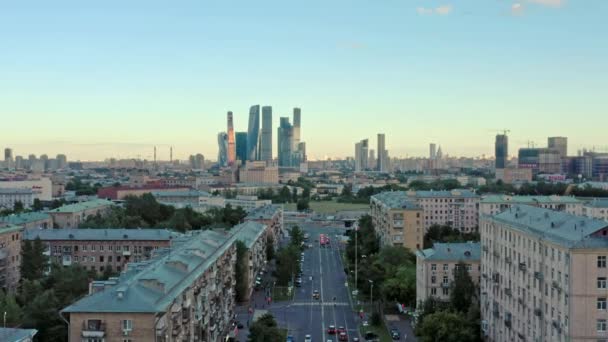 MOSCOW, RUSSIA - JUNE, 2019: Aerial drone shot of residential buildings and Moscow City on background — Stock Video