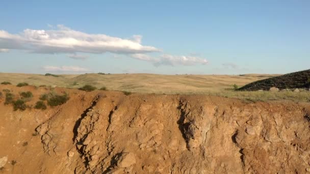 Sand hills drone anerial shot, field under bright cloudy sky — Stock video