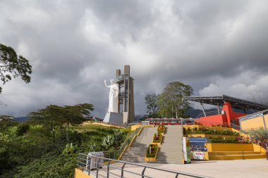 FLORIDABLANCA, COLOMBIA - MAY 3: Wide angle view of the beautiful El Santisimo Jesus Statue in the El Santisimo Eco Park in Floridablanca, Colombia on May 3, 2016. clipart