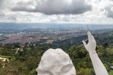 View of the hands and head of the El Santisimo Jesus Statue above Bucaramanga, Colombia. clipart