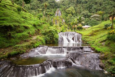 Beautiful long exposure view of the waterfall near the Santa Rosa Thermal Spa in Santa Rosa de Cabal in Colombia. clipart
