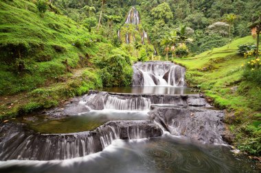 Long exposure view of the waterfall near the Santa Rosa Thermal Spa in Santa Rosa de Cabal in Colombia. clipart