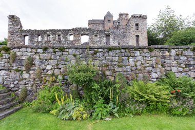 Beautiful gardens in the front of the remains of Castle Campbell near Dollar, Scotland.