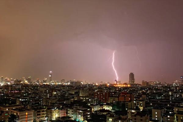 Lightening strikes during an evening monsoon storm in Bangkok, Thailand.