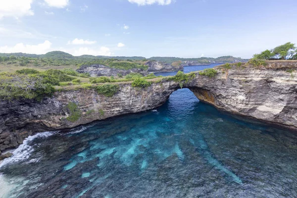 Clear blue waters at Broken Beach on the island of Nusa Penida in Indonesia.