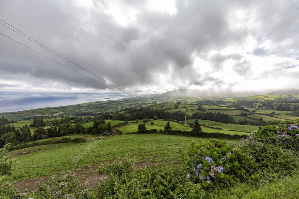 Beautiful view of the dramatic cloudscape above Vila Franca do Campo on Sao Miguel, Portugal. 