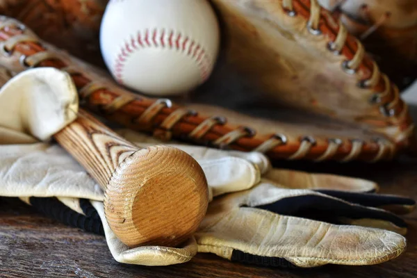 A close up image of old used baseball equipment.