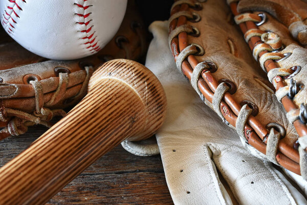A close up image of old used baseball equipment.