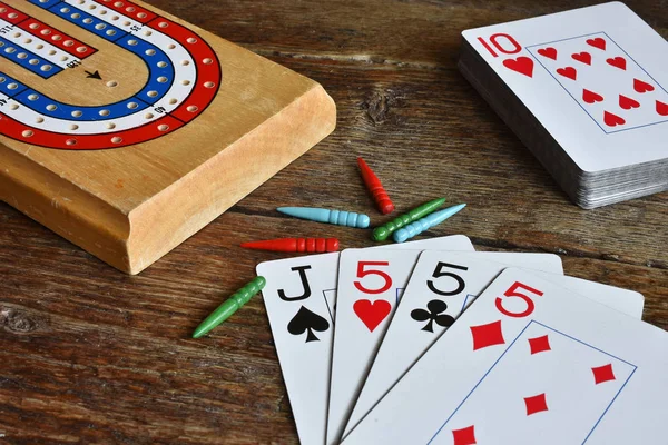 A close up image of winning cards in a game of cribbage.