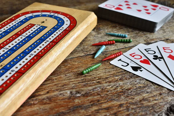 A close up image of winning cards in a game of cribbage.