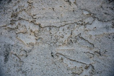 Eski yıpranmış beton duvardaki dokunun soyut bir görüntüsü. 