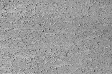 Kırmızıdaki dokunun soyut bir görüntüsü bir sıva duvarı.