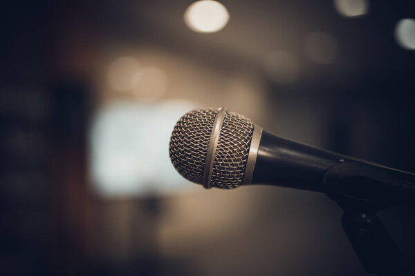 microphone in concert hall or conference room soft and blur styl