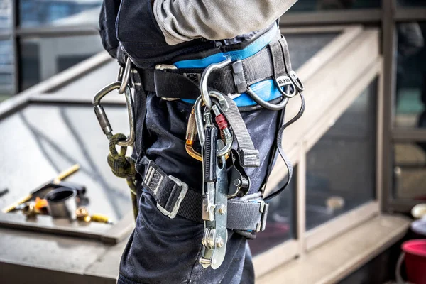 Close-up harnesses and gloves, Working at height equipment. Fall arrestor device for worker with double hooks for safety body harness on selective focus, Safety background and beautiful, Safety first