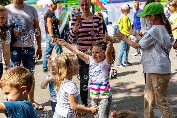 MINSK, BELARUS - 1 JUNY, 2019: happy child playing in the park w — Stock Photo, Image