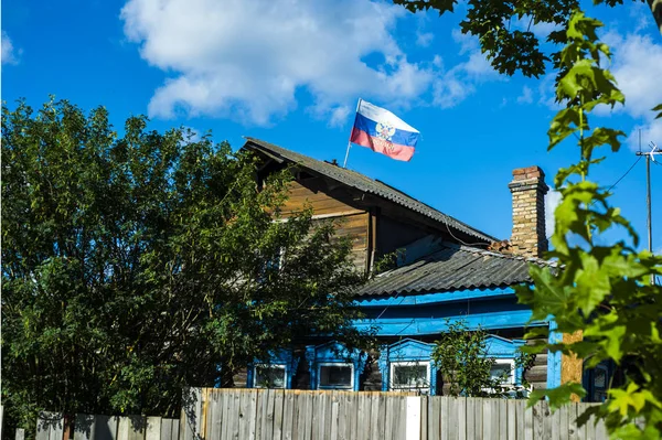 Russian house in the village. Patriots. Real Russia