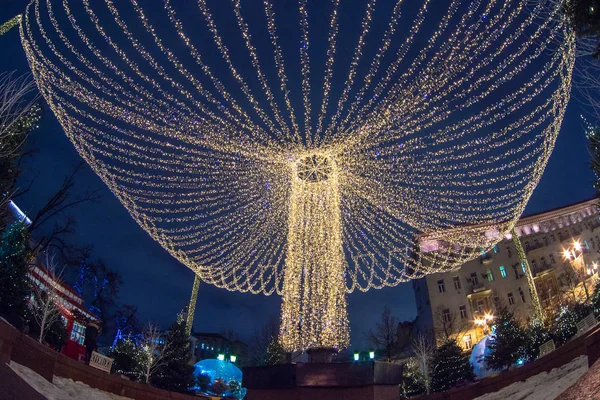 Christmas illumination, market shop, festively decorated. background blur