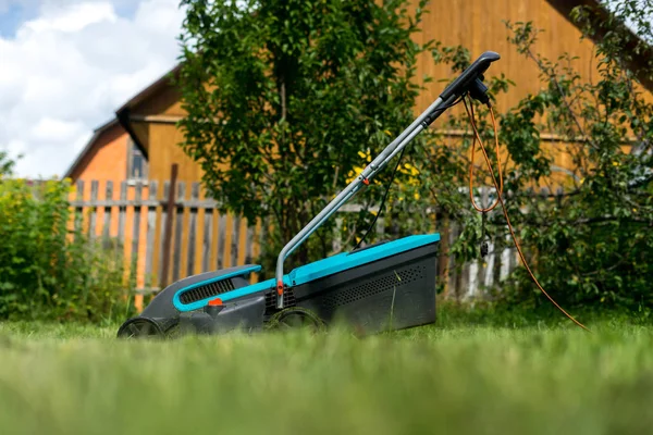 outdoor worker mowing the lawn