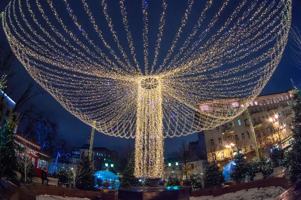 Christmas illumination, market shop, festively decorated. background blur