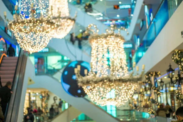 Christmas illumination, shopping center, festively decorated. background blur