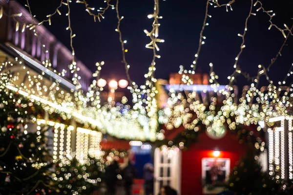 Christmas illumination, market shop, festively decorated. background blur