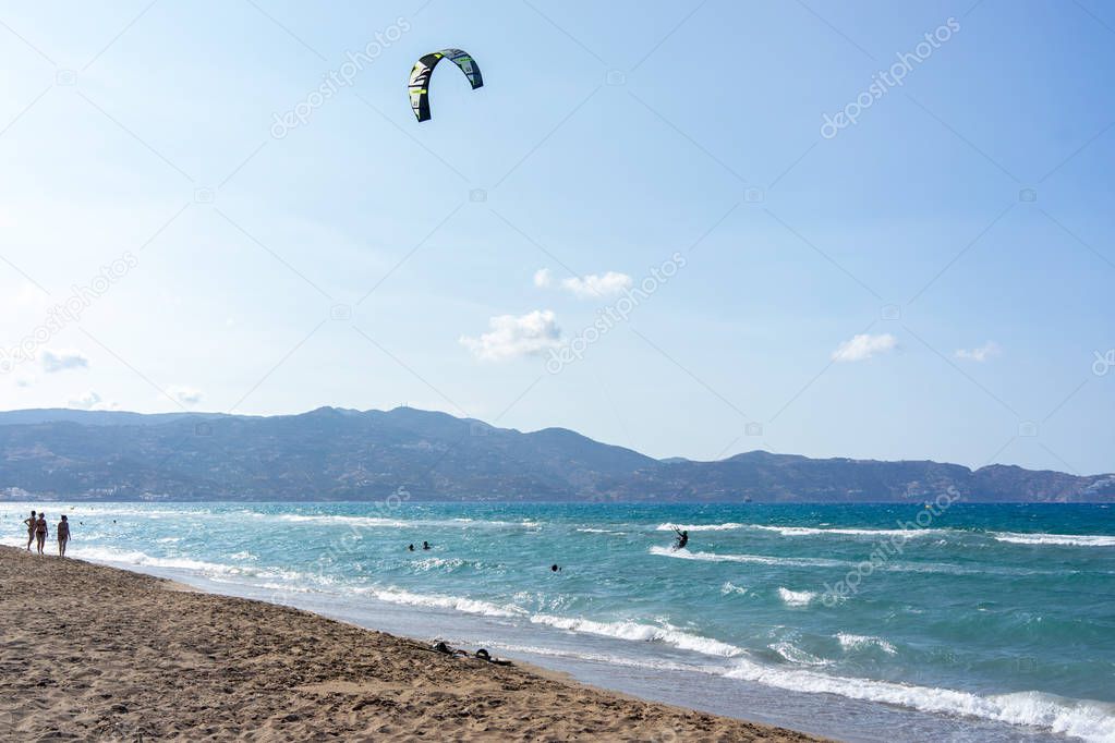 Extreme sport kitesurfing in tropical blue ocean