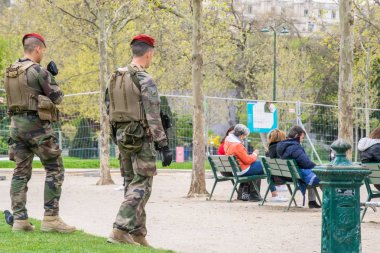 Paris, France, 2019: French military patrol in the center of Paris near the Eiffel Tower clipart
