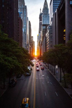 Sunset over 42nd Street with the colorful lights of traffic through Midtown Manhattan, New York City NYC clipart