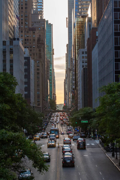 Sunset over 42nd Street with the colorful lights of traffic through Midtown Manhattan, New York City NYC