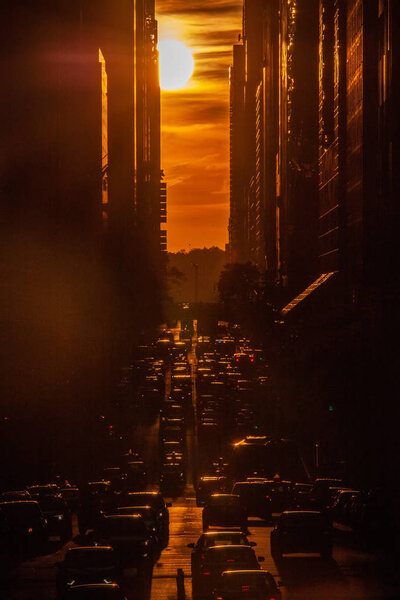Sunset over 42nd Street with the colorful lights of traffic through Midtown Manhattan, New York City NYC