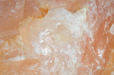 Rose quartz. The texture of the mineral. Macro shooting of natural gemstone. The raw mineral. Abstract background. clipart
