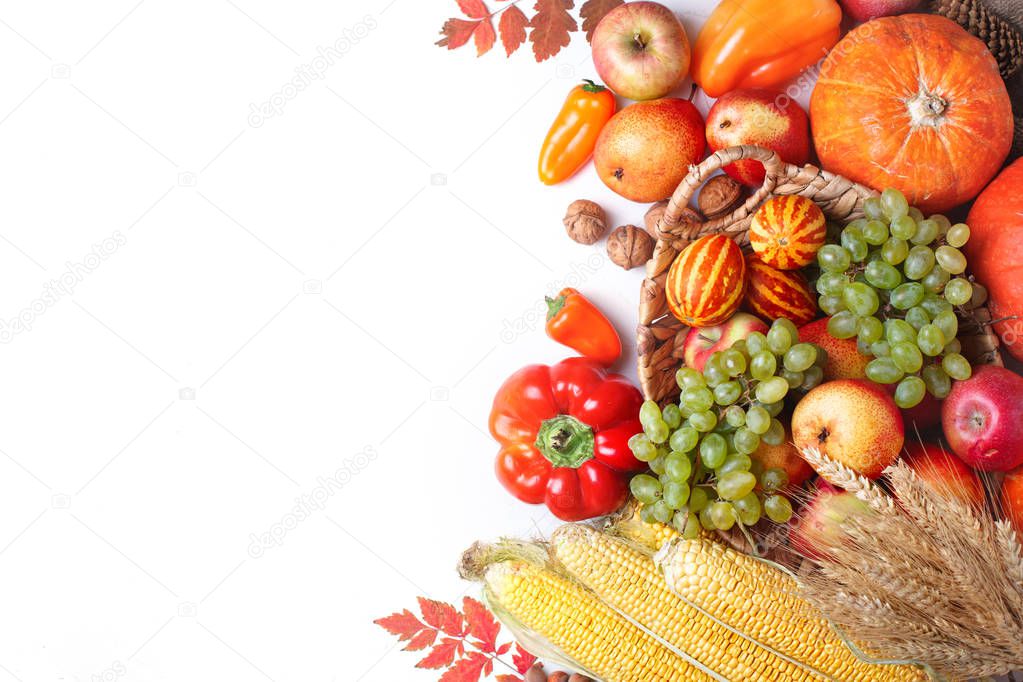 Happy Thanksgiving Day background, table decorated with Pumpkins, Maize, fruits and autumn leaves. Harvest festival. The view from the top. Horizontal. Background with copy space.