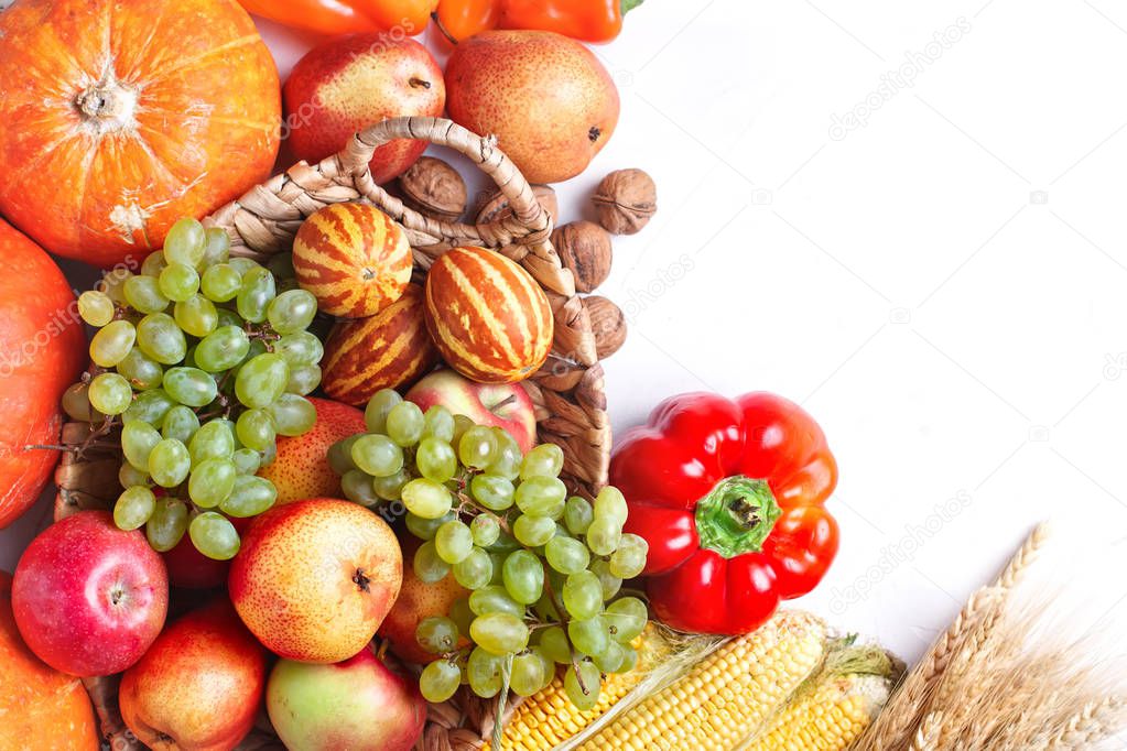 Happy Thanksgiving Day background, table decorated with Pumpkins, Maize, fruits and autumn leaves. Harvest festival. The view from the top. Horizontal. Background with copy space.