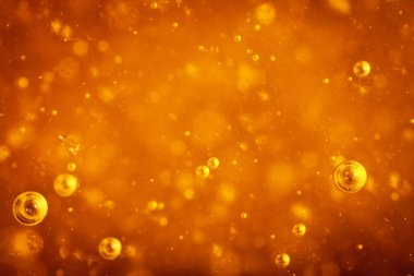 Soyut makro bal baloncukları parlak kehribar renginde yakınlaşır. Bal dokusu. Sağlıklı gıda konsepti. Diyet olsun. Seçici odak.