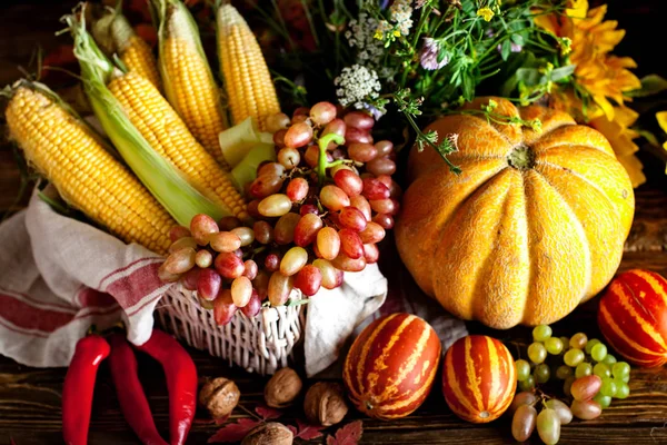 The table, decorated with vegetables and fruits. Harvest Festival. Happy Thanksgiving. Autumn background. Selective focus. Stock Picture