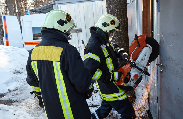 The rescue team opens the blocked door