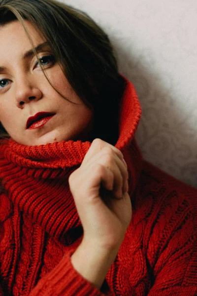 Woman in red sweater