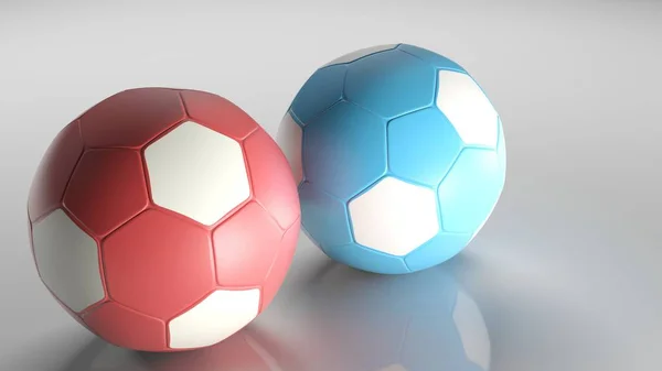 Ein Roter Fußballball Neben Einem Blauen Auf Einem Glänzenden Boden — Stockfoto