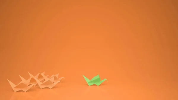 折り紙グリーン ペーパー クレーン クレーン グループ領域 オレンジ色の背景のコピーとリーダーシップ モチベーション コンセプト アイデアをリード — ストック写真