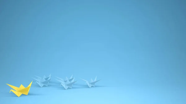 Origami yellow paper crane leading group of cranes, leadership motivation concept idea with copy space, blue background