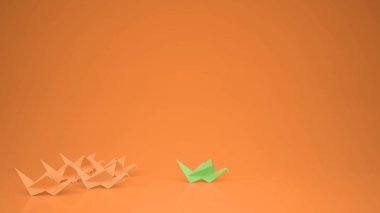 Origami yeşil kağıt vinç vinç, Grup liderlik motivasyon kavramı fikir kopyalama alanı, turuncu arka plan ile önde gelen