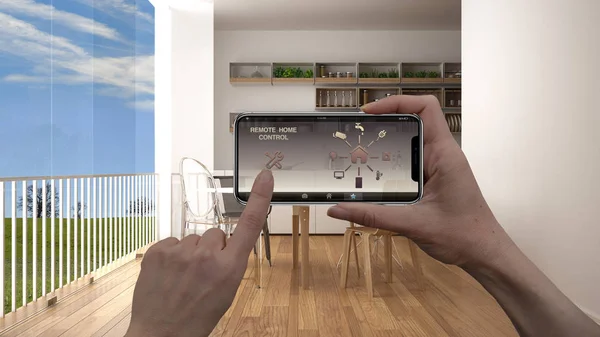 Remote home control system on a digital smart phone tablet. Device with app icons. Interior of kitchen with panoramic window in the background, architecture design