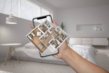 Artırılmış gerçeklik kavramı. El hayat, modern bulanık yatak odası arka plan için 3d açılır etkileşimli ev haritalar benzetimini yapmak için kullanılan Ar uygulaması ile akıllı telefon tutarak