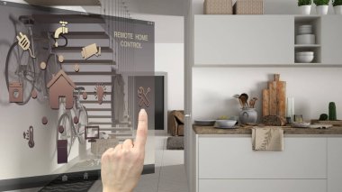 Akıllı ev kontrol kavramı, mobil uygulama bulanık arka plan gösteren modern mutfak, mimari iç tasarım dijital arabirimi denetleme el