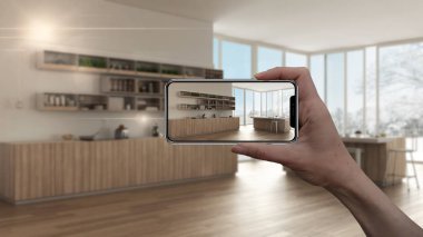 Akıllı telefon, Ar uygulama, tutan el mobilya taklit ve gerçek ev mimar tasarım konsepti, iç tasarım ürünleri arka plan, mutfak dolapları ve ada ile bulanıklık