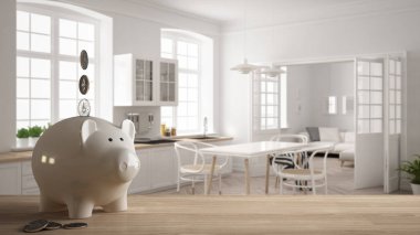 Ahşap masa üstü veya paralar, İskandinav klasik mutfak, pahalı ev iç tasarım, yenileme kavramı mimarisi yeniden yapılanma ile beyaz piggy banka ile raf