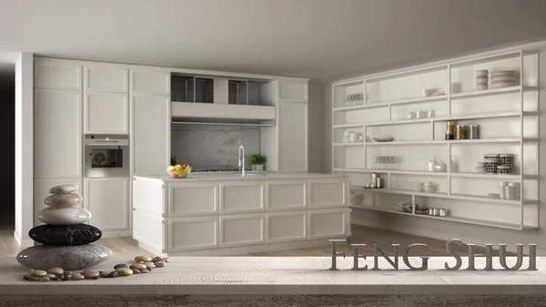 Полка белого стола с галечным балансом и 3d буквами делает слово фэн-шуй над классической белой кухней в современной квартире, дзен концепт дизайна интерьера — стоковое фото